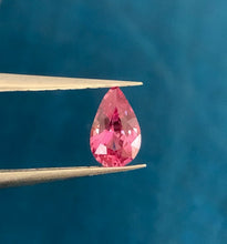 Pinkish orange Padparadscha sapphire with brilliant natural sparkle.