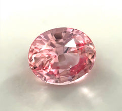 Loupe-clean peach Padparadscha sapphire loose gemstone with natural brilliance.