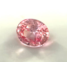 Oval-cut unheated Padparadscha sapphire for engagement rings and custom jewellery.
