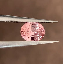 Natural peachy pink-orange Padparadscha sapphire with beautiful luster.