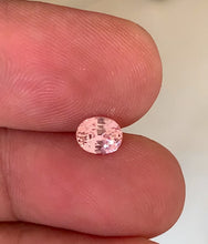 Elegant 1.14 carat peach Padparadscha sapphire with oval cut.
