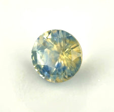 Unheated green blue bi-color sapphire loose gemstone with subtle smoky appearance.