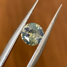 Rare unheated sapphire featuring green, blue and golden-yellow colours.