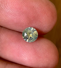 Fine natural bi-color sapphire with excellent brilliance and unique smoky character.