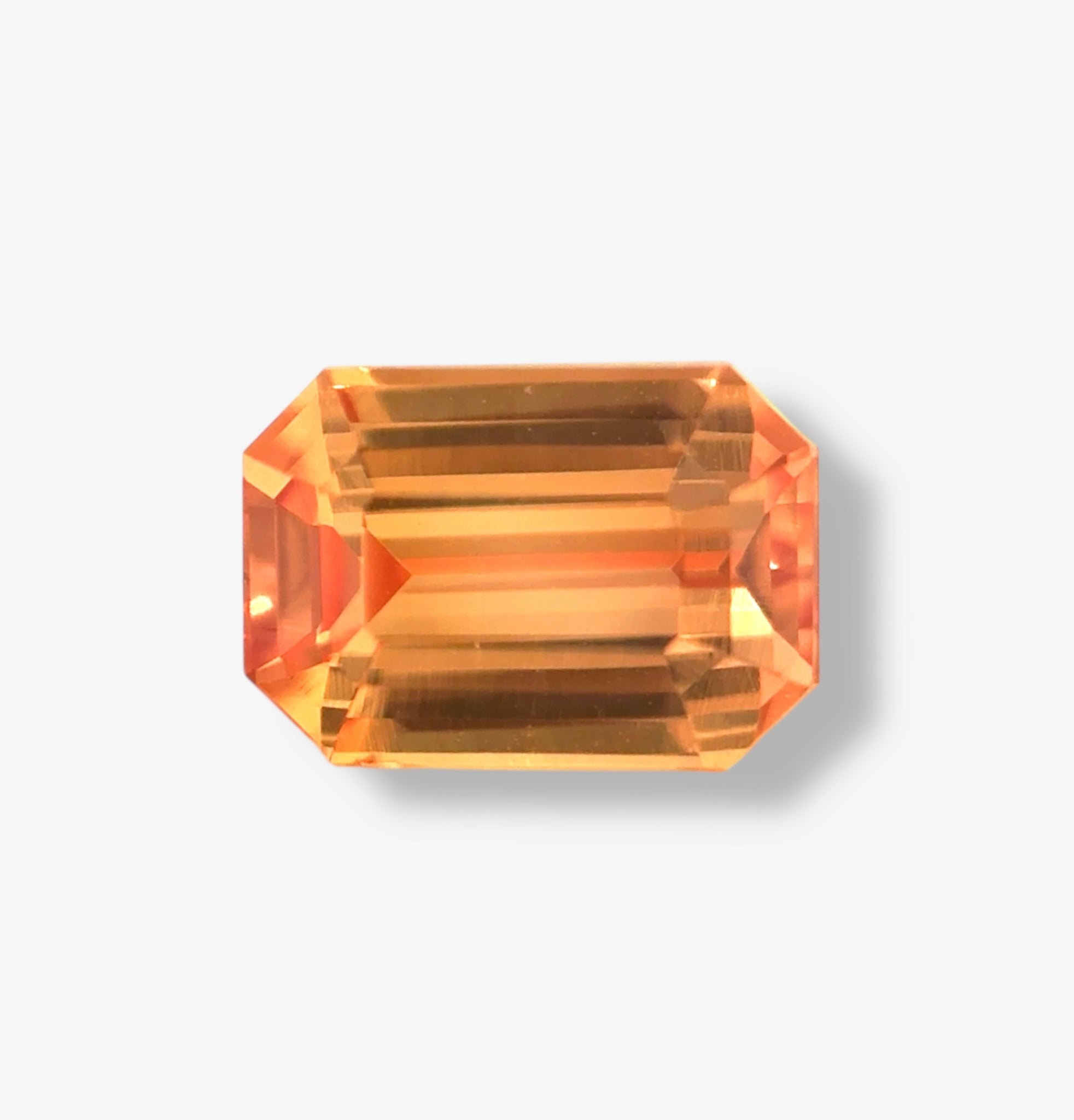 1.17 carat unheated Padparadscha sapphire Emerald cut, natural pink orange gemstone