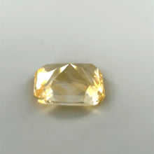 Radiant cut vivid yellow sapphire photographed in natural daylight