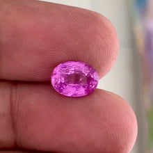 3.05 carat unheated bubblegum pink sapphire oval cut in natural daylight