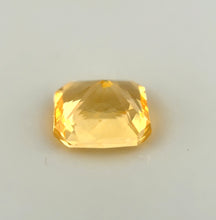 Premium natural yellow sapphire loose stone displaying bright luster and clean clarity