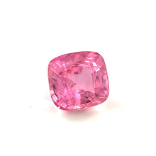Cushion cut Padparadscha sapphire showing brilliant luster and faceting under daylight