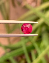 1.13 carat round cut Pigeon’s Blood ruby with vivid red color and brilliant luster