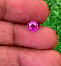 1.07carat unheated bubblegum pink sapphire round cut in natural daylight